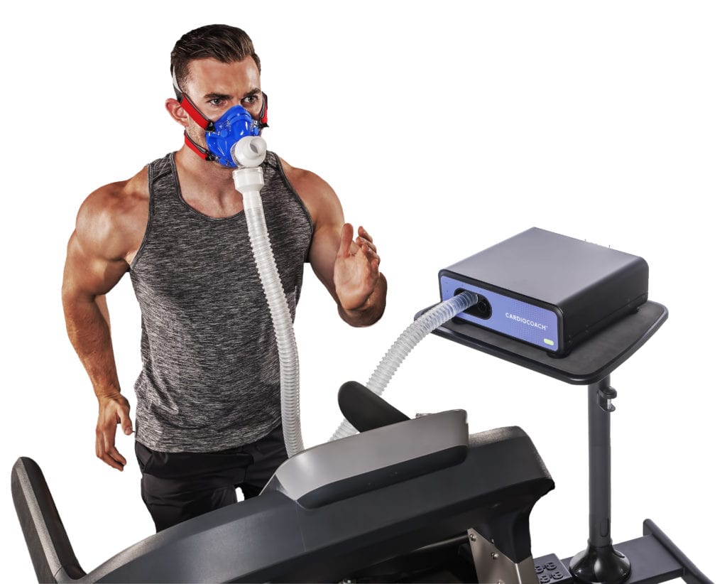 man running on treadmill wearing vo2 mask