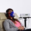 woman in chair wearing vo2 mask