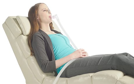 woman on chair doing a breathing test